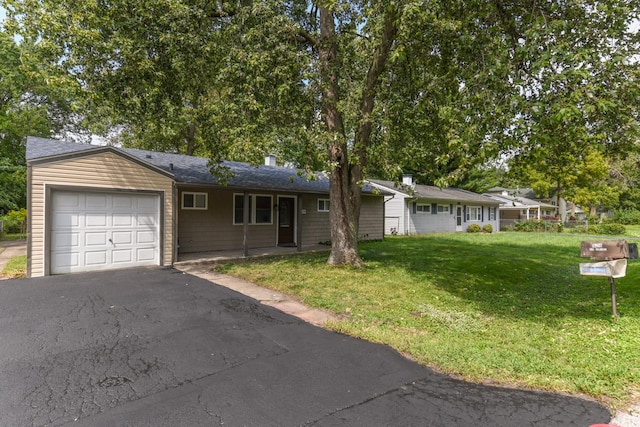 single story home with a front yard and a garage