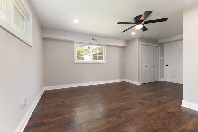 unfurnished room featuring ceiling fan and dark hardwood / wood-style floors