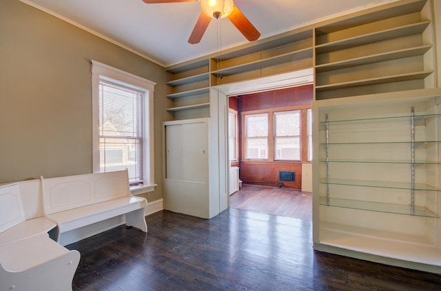 entrance foyer with dark hardwood / wood-style floors, ceiling fan, and crown molding