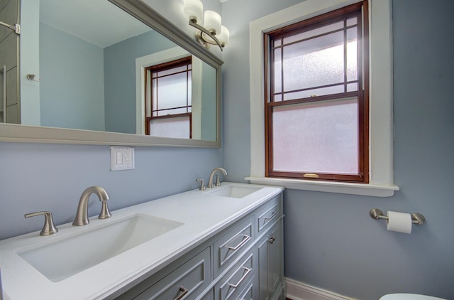 bathroom with vanity and a healthy amount of sunlight