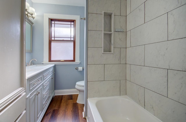 bathroom featuring hardwood / wood-style floors, vanity, and toilet