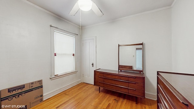 bedroom featuring ceiling fan, light hardwood / wood-style flooring, and ornamental molding