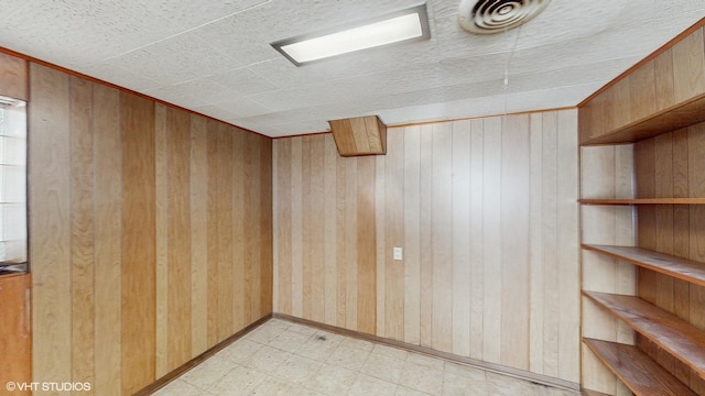 empty room with wooden walls