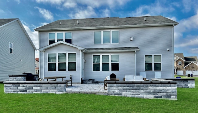 back of property with a patio, a lawn, and exterior kitchen