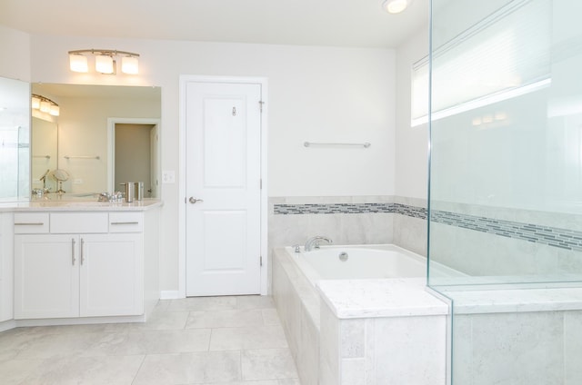 bathroom with a bath and vanity