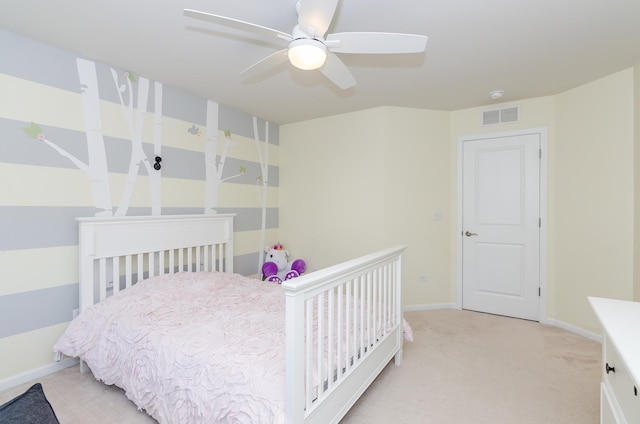 bedroom with light carpet, visible vents, a ceiling fan, and baseboards