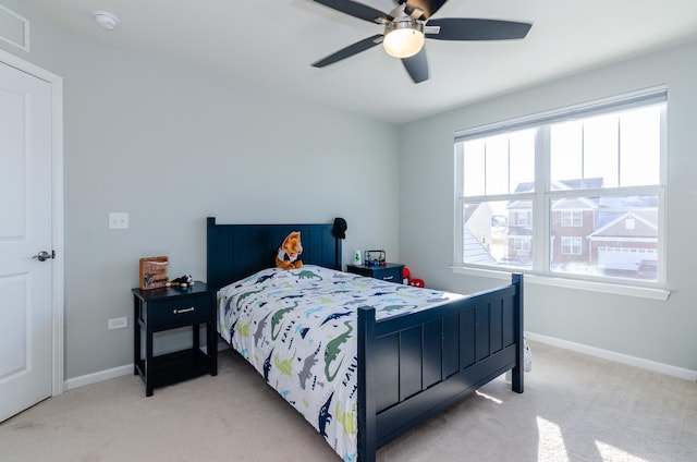 bedroom featuring visible vents, baseboards, carpet floors, and ceiling fan