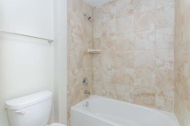 bathroom featuring shower / tub combination and toilet