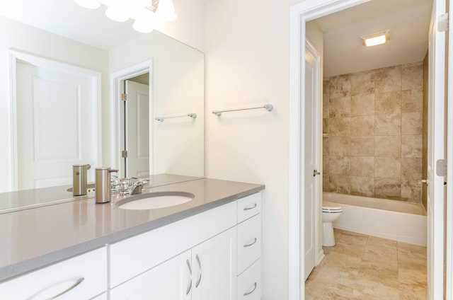 full bathroom featuring vanity, tile patterned floors, toilet, and shower / tub combination