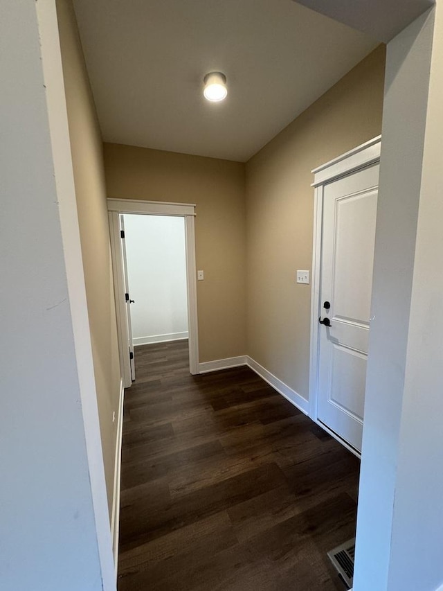 hall with dark hardwood / wood-style flooring