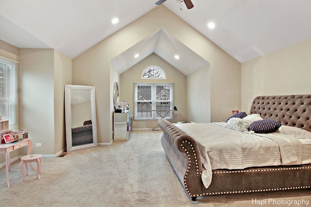 bedroom with light carpet, vaulted ceiling, and ceiling fan