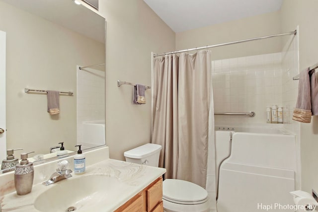 bathroom with vanity, toilet, and walk in shower