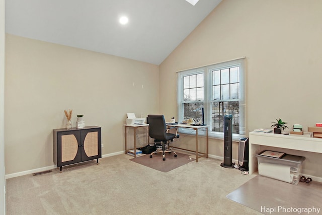 office featuring light colored carpet and high vaulted ceiling