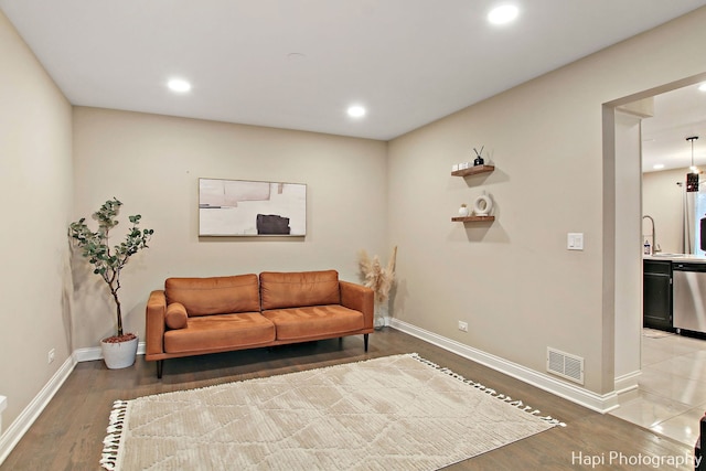 sitting room featuring wood-type flooring