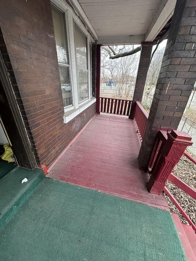 wooden terrace with a porch