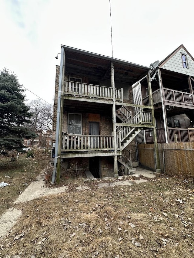 back of property with a balcony