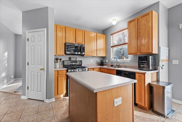 kitchen with dishwasher, a center island, range, light tile patterned floors, and sink