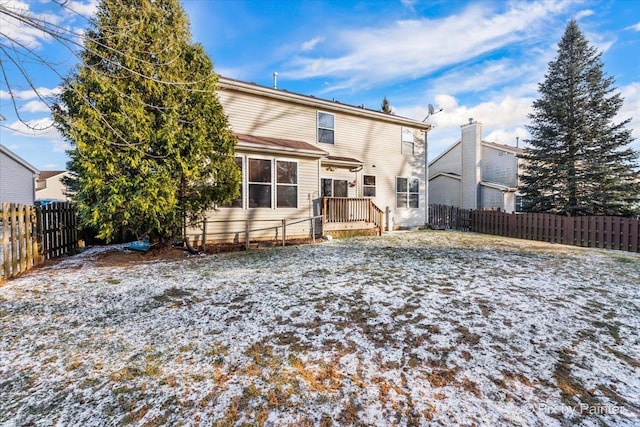 view of snow covered house