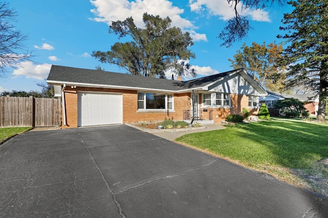 view of front of home featuring a garage and a front lawn