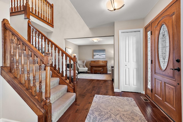 foyer entrance with dark wood-type flooring