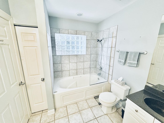 full bathroom featuring tile patterned floors, toilet, vanity, and tiled shower / bath