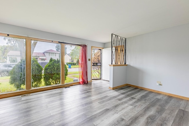 spare room with light wood-type flooring