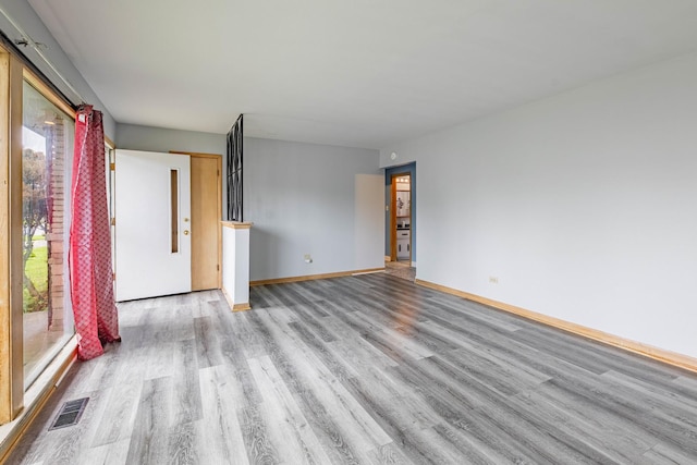 unfurnished room featuring light hardwood / wood-style floors