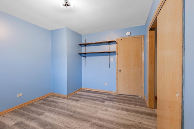 spare room with light hardwood / wood-style flooring