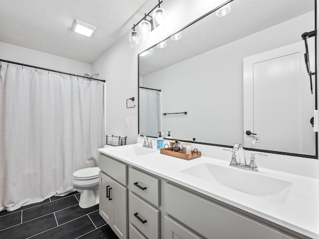 bathroom with tile patterned floors, a textured ceiling, toilet, vanity, and a shower with shower curtain