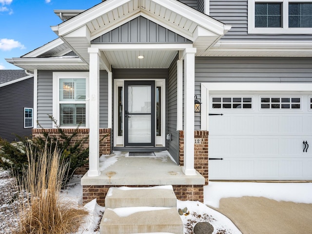 view of snow covered property entrance