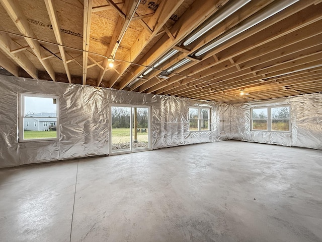 misc room featuring a wealth of natural light and concrete floors