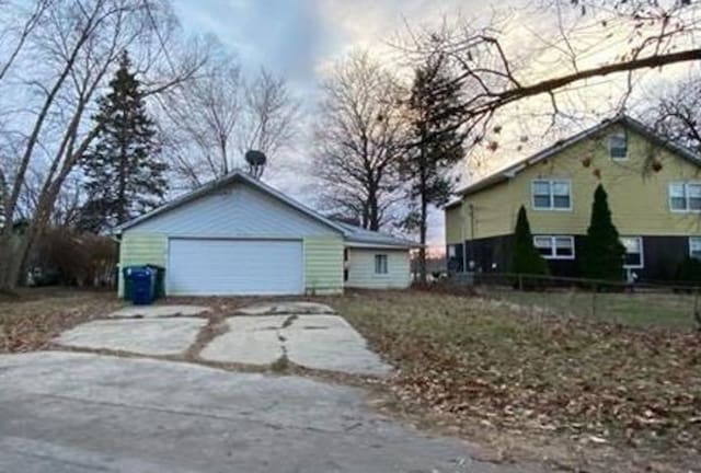 view of property exterior featuring a garage