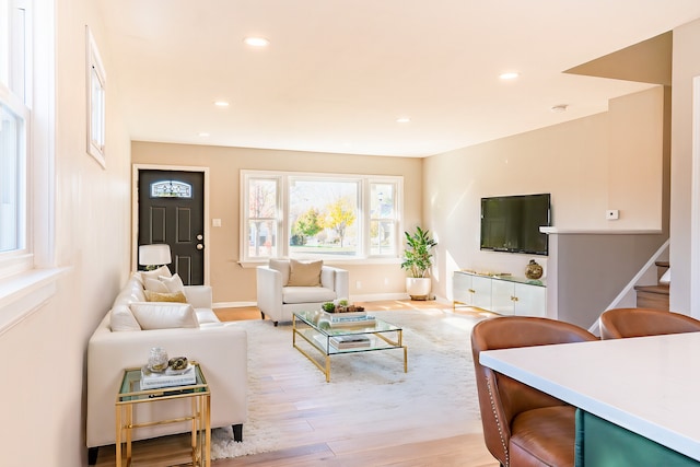 living room with light hardwood / wood-style flooring