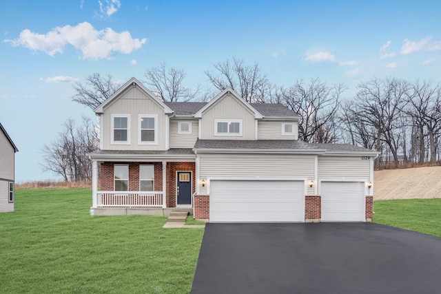 view of front of home with a front lawn, a porch, and a garage