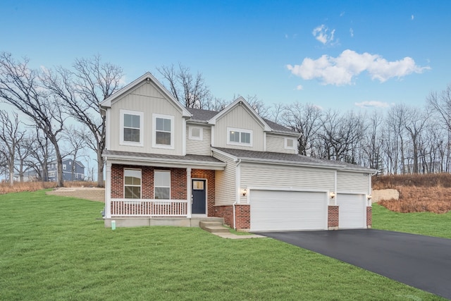 view of front of home with a porch, a garage, and a front yard