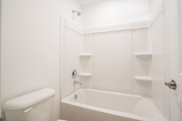 bathroom featuring toilet and washtub / shower combination