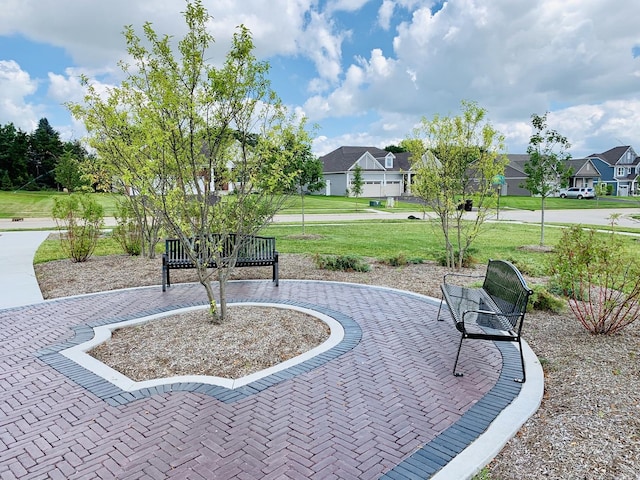 view of home's community with a lawn