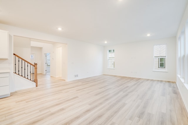 unfurnished living room featuring light wood-type flooring