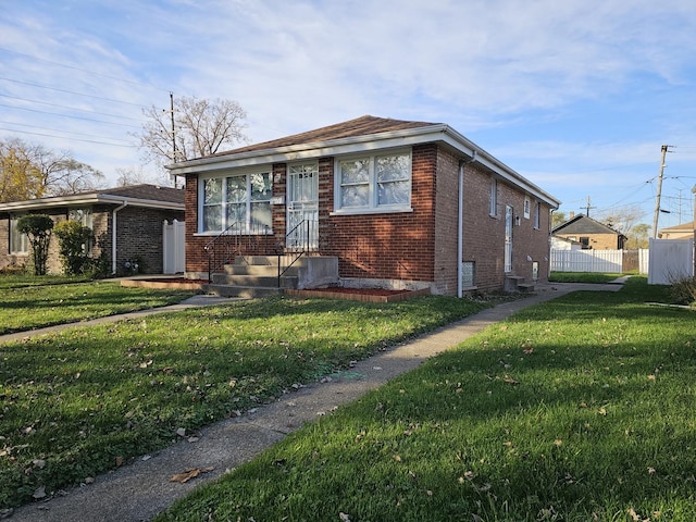 view of front of home with a front lawn