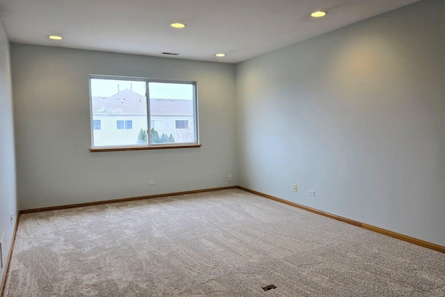 unfurnished room featuring carpet