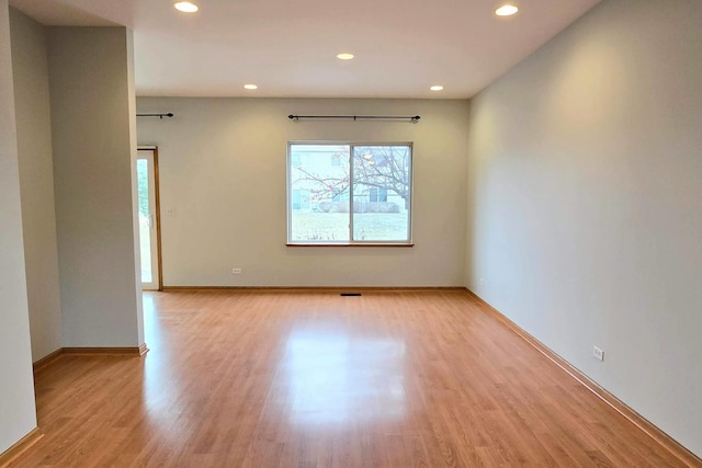 unfurnished room with light hardwood / wood-style floors