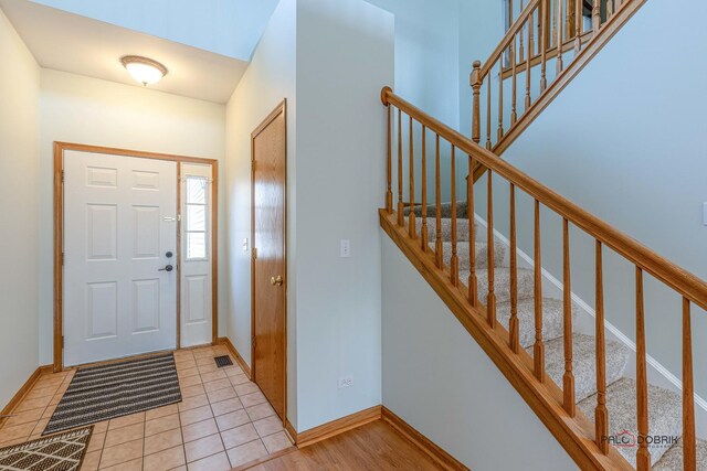 kitchen featuring sink, light hardwood / wood-style floors, and decorative light fixtures