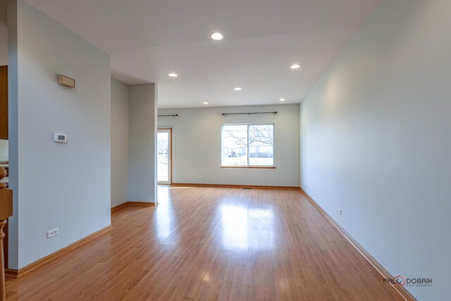 unfurnished living room with light wood-type flooring