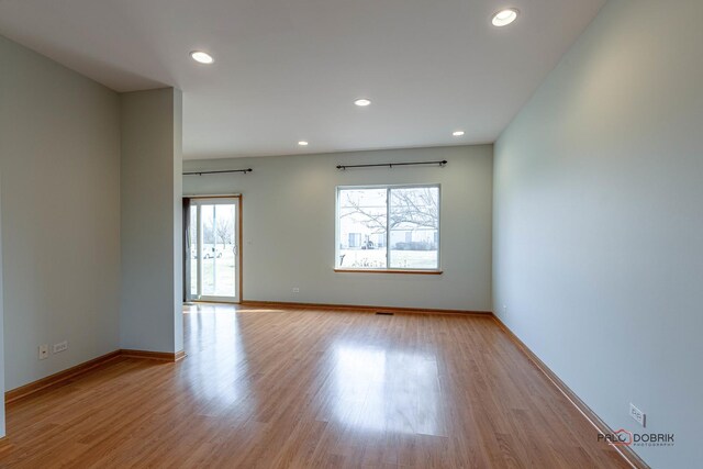 kitchen featuring sink, appliances with stainless steel finishes, and light hardwood / wood-style flooring