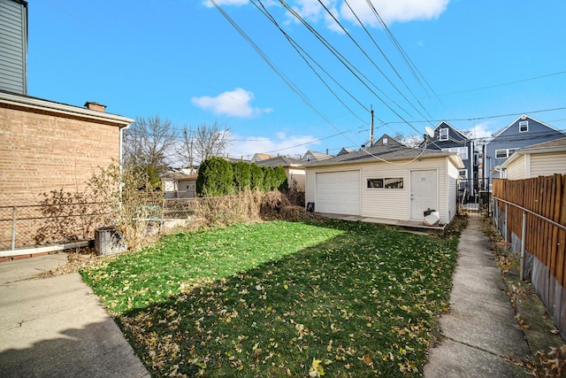 view of yard with an outbuilding and a garage