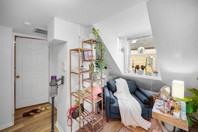 sitting room with light hardwood / wood-style floors