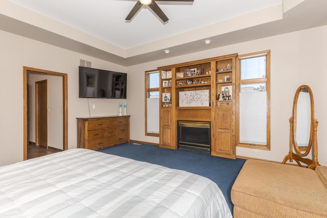 carpeted bedroom featuring ceiling fan