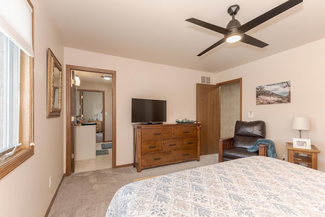 bedroom with ceiling fan and light carpet