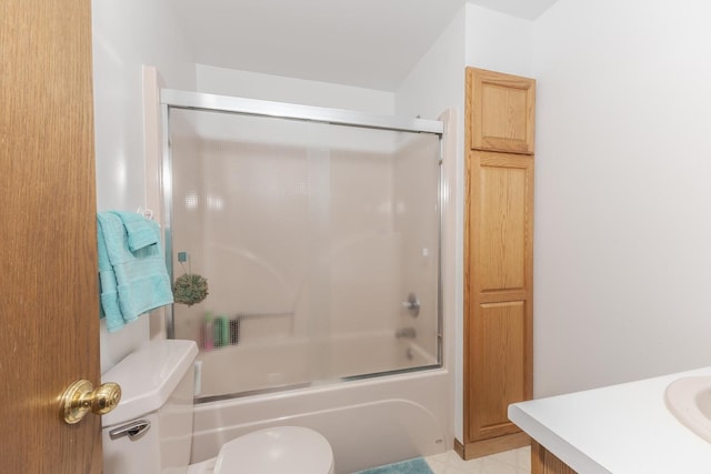 full bathroom with shower / bath combination with glass door, vanity, and toilet