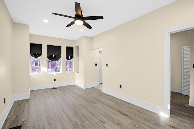 unfurnished living room with ceiling fan and light wood-type flooring